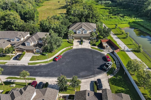 aerial view with a water view and a residential view