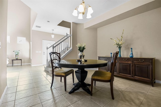 dining space with visible vents, an inviting chandelier, light tile patterned flooring, baseboards, and stairs