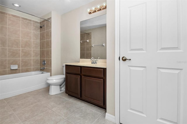 full bathroom with washtub / shower combination, tile patterned flooring, vanity, and toilet