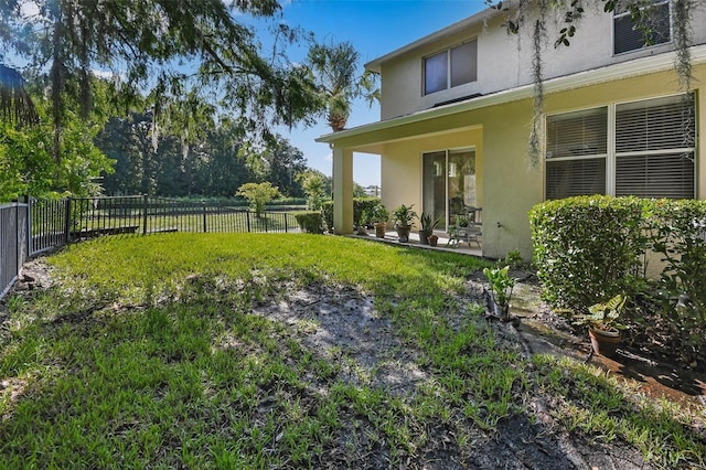 view of yard featuring a patio area and a fenced backyard