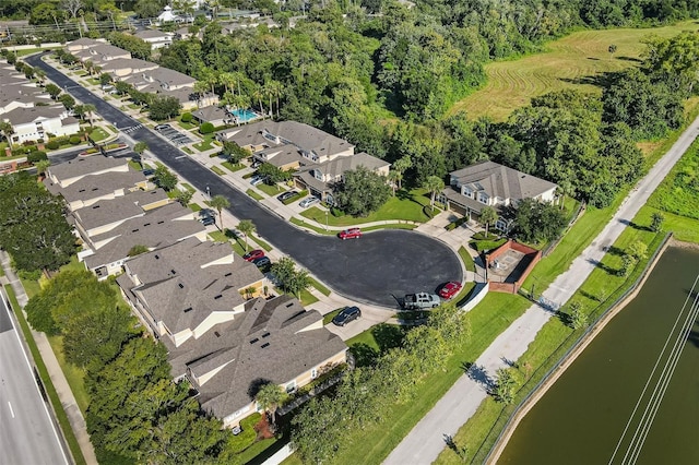 aerial view with a residential view and a water view