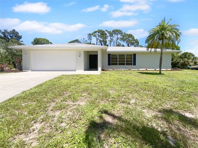 single story home with a garage, concrete driveway, a front lawn, and stucco siding