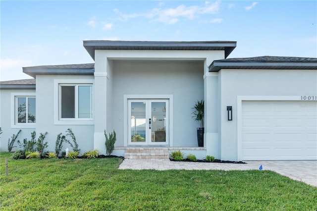 view of front of house with a garage and a front yard