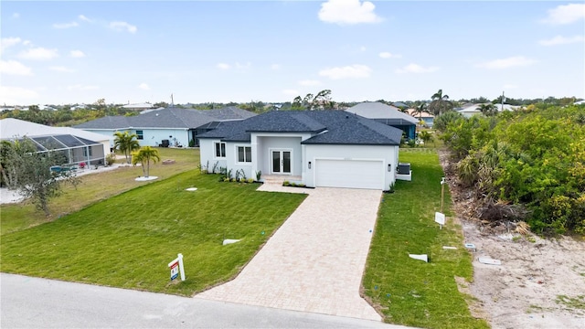 view of front of home featuring a garage and a front yard