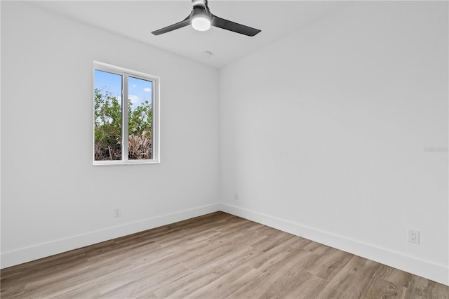 spare room with ceiling fan and light wood-type flooring