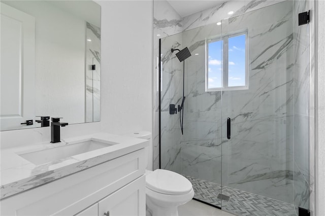 bathroom with vanity, toilet, and an enclosed shower