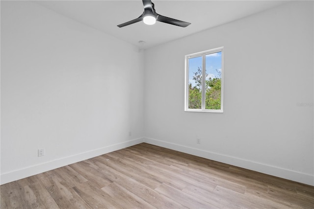 spare room with light hardwood / wood-style floors and ceiling fan