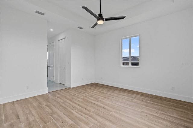 unfurnished room featuring ceiling fan and light hardwood / wood-style flooring