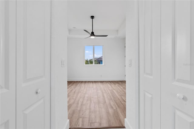 spare room with hardwood / wood-style floors and ceiling fan