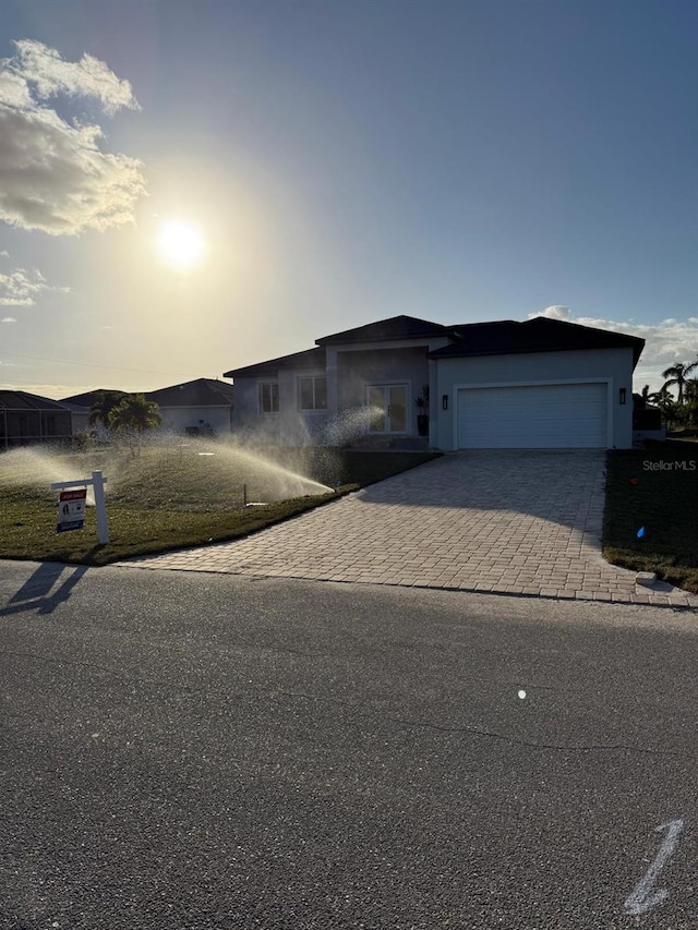 view of front of property with a garage