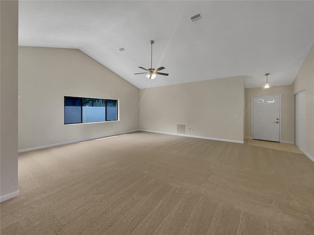 unfurnished living room featuring light carpet, visible vents, baseboards, and vaulted ceiling