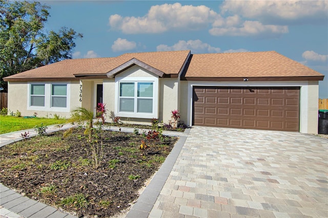 ranch-style house featuring a garage