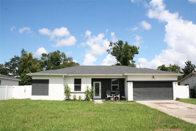 view of front of home featuring fence, driveway, an attached garage, stucco siding, and a front lawn