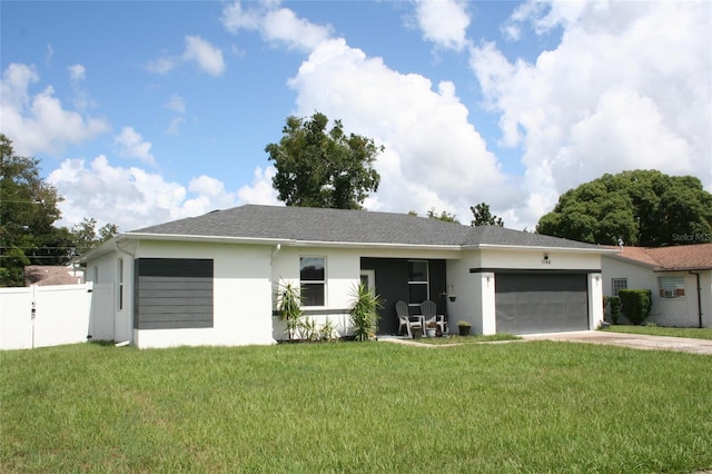 ranch-style home featuring a front yard and a garage