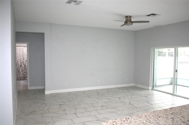 unfurnished room featuring visible vents, baseboards, marble finish floor, and a ceiling fan