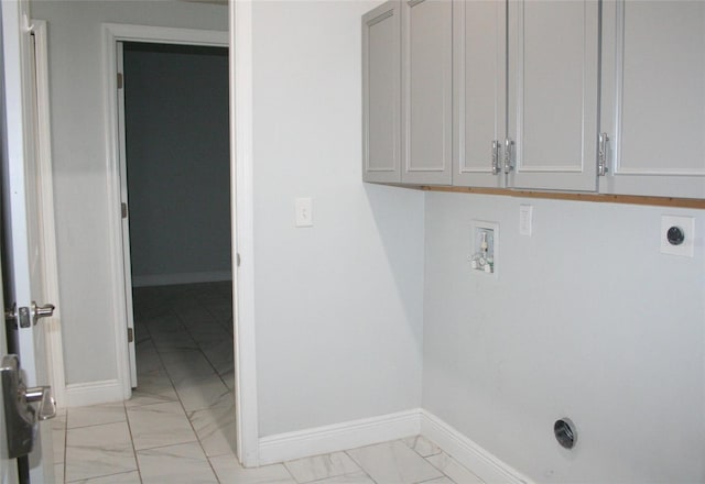 laundry room featuring baseboards, hookup for an electric dryer, cabinet space, washer hookup, and marble finish floor