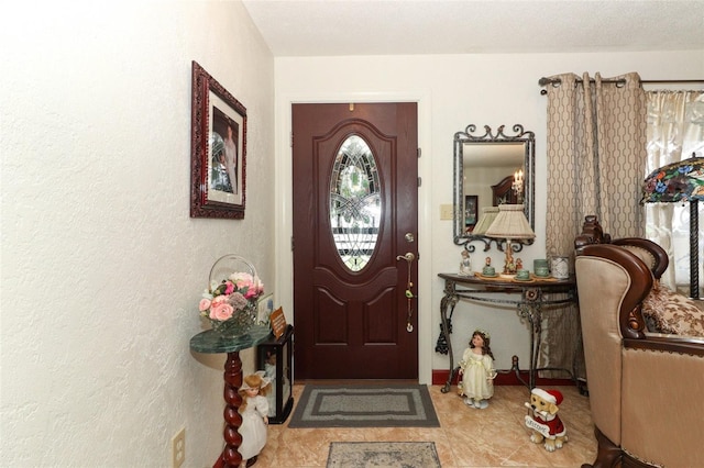 entryway featuring a textured ceiling