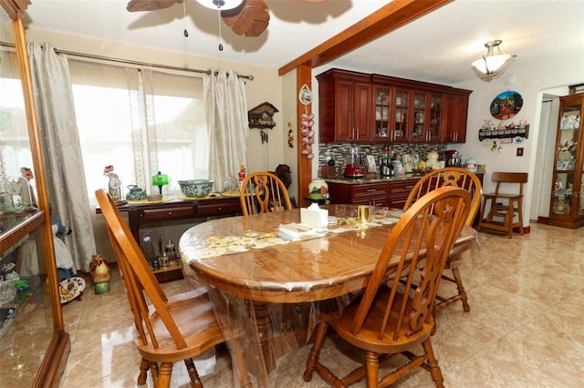 tiled dining room with ceiling fan