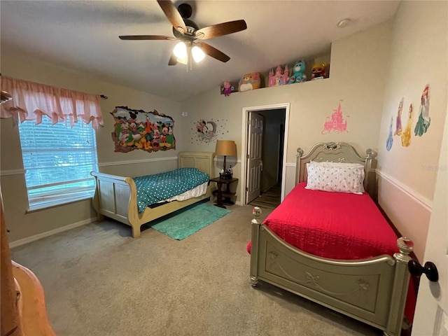 bedroom with vaulted ceiling, ceiling fan, carpet, and baseboards