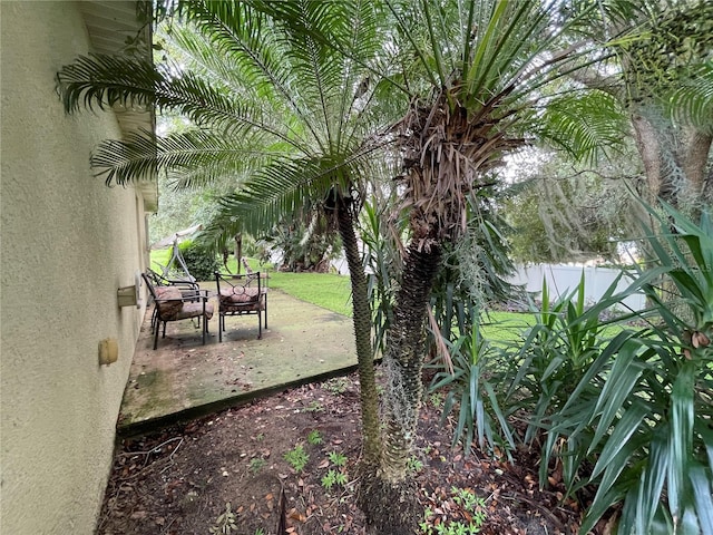 view of yard featuring a patio and fence