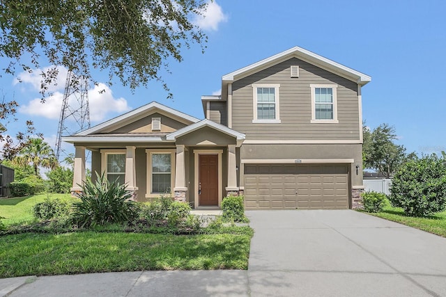 view of front facade with a garage and a front yard