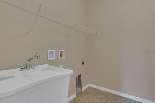 laundry room with hookup for a washing machine, sink, and electric dryer hookup