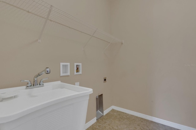 laundry room with baseboards, laundry area, a sink, washer hookup, and electric dryer hookup