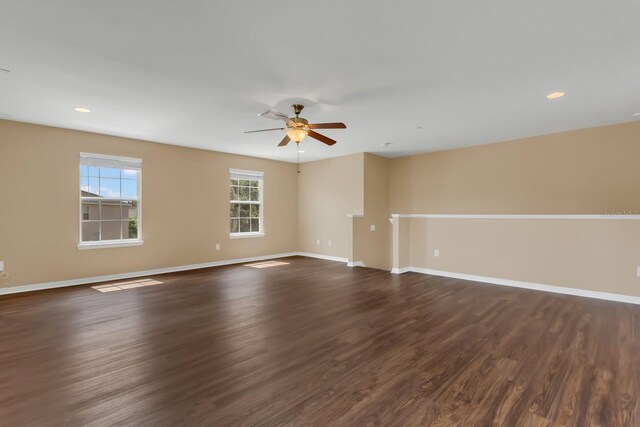 unfurnished room with dark wood finished floors, recessed lighting, ceiling fan, and baseboards