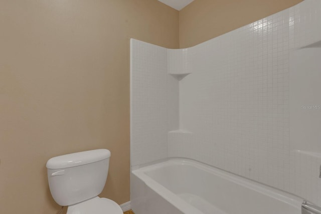 bathroom featuring toilet and shower / washtub combination