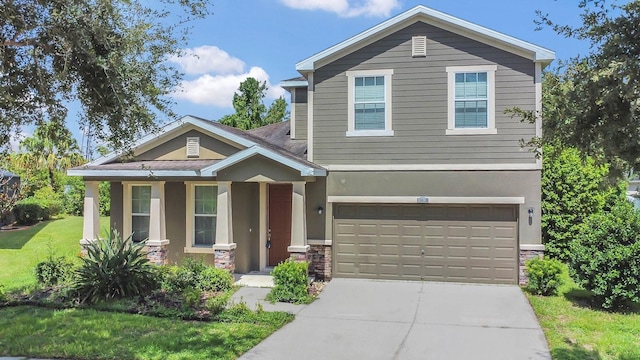 view of front of house featuring concrete driveway, an attached garage, a front yard, and stucco siding