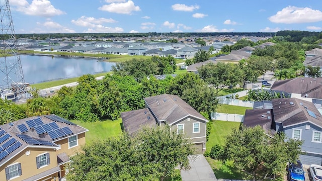 birds eye view of property with a residential view and a water view