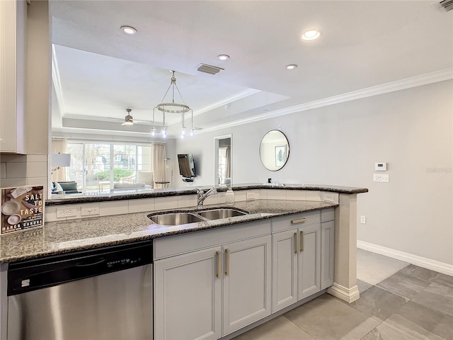 kitchen with visible vents, crown molding, dishwasher, a raised ceiling, and a sink