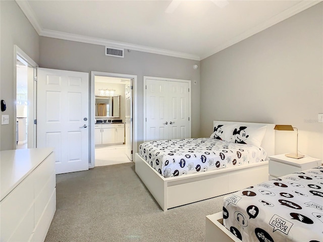 carpeted bedroom featuring connected bathroom, visible vents, a closet, and ornamental molding