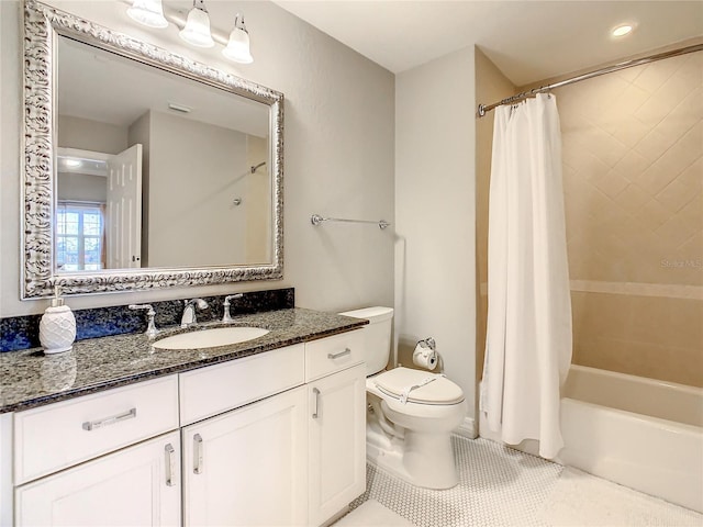 bathroom with tile patterned floors, shower / tub combo, toilet, and vanity