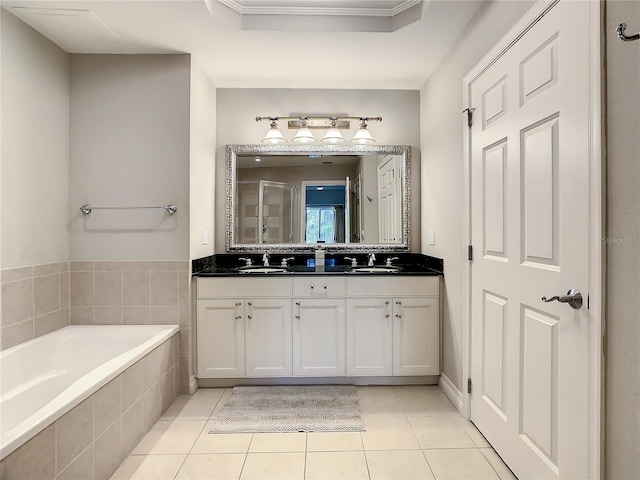 bathroom featuring tile patterned floors, independent shower and bath, crown molding, and vanity