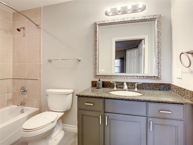 full bathroom featuring toilet, bathtub / shower combination, and vanity