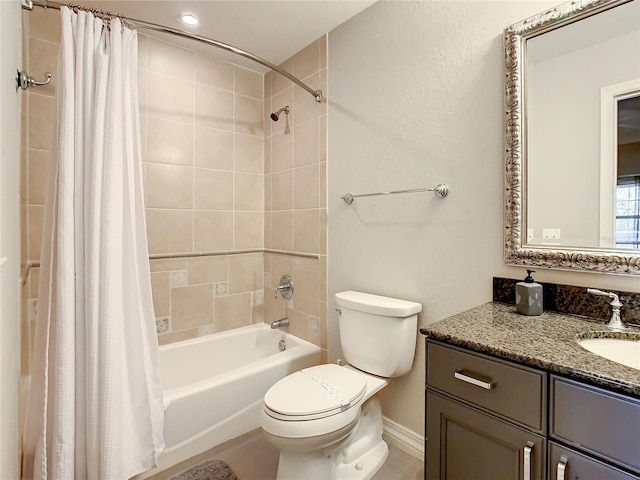 bathroom featuring vanity, toilet, and shower / bath combo with shower curtain