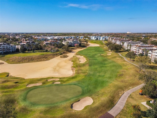 bird's eye view with view of golf course