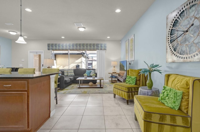 kitchen with decorative light fixtures and light tile patterned floors