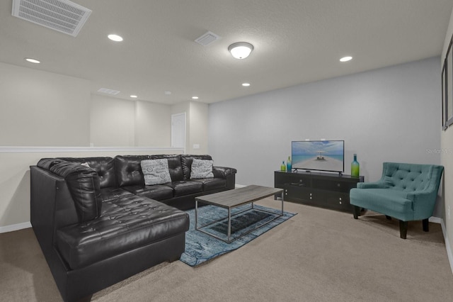 living room with carpet and a textured ceiling