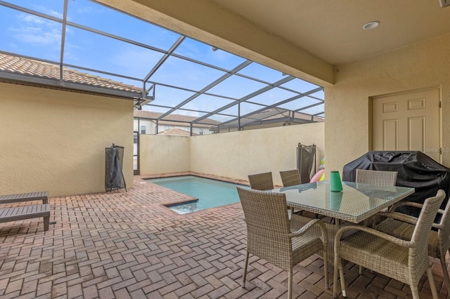 view of patio featuring glass enclosure