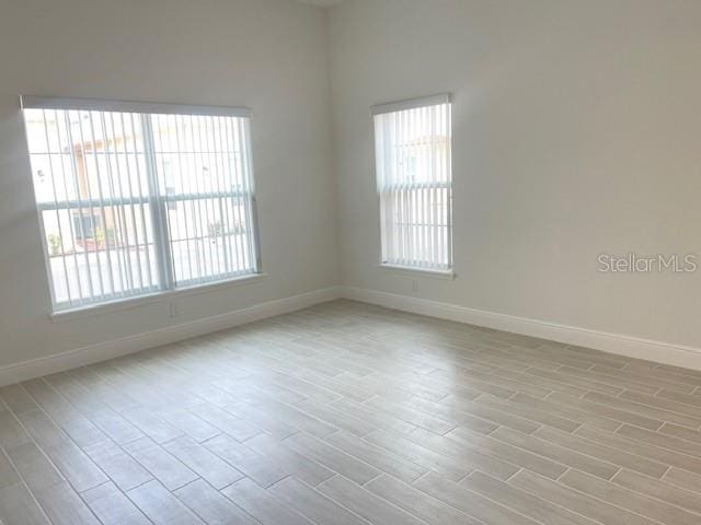 unfurnished room featuring light hardwood / wood-style floors