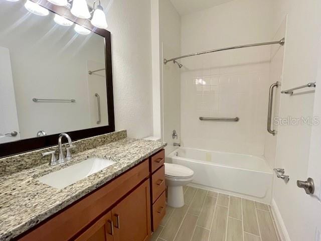 full bathroom featuring bathtub / shower combination, toilet, and vanity