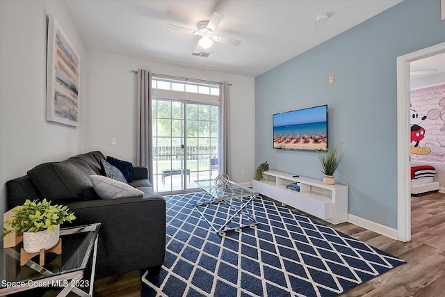 living room featuring vaulted ceiling, wood-type flooring, french doors, and ceiling fan