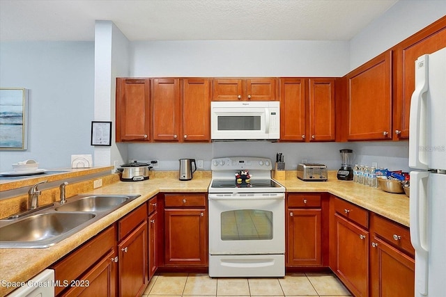 kitchen featuring white appliances, light tile patterned floors, a textured ceiling, and sink