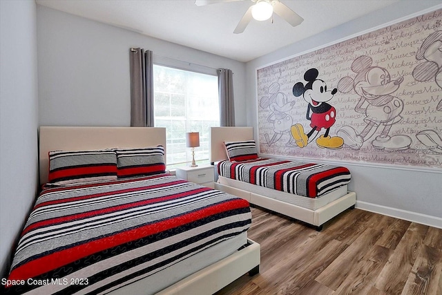 bedroom with wood-type flooring and ceiling fan