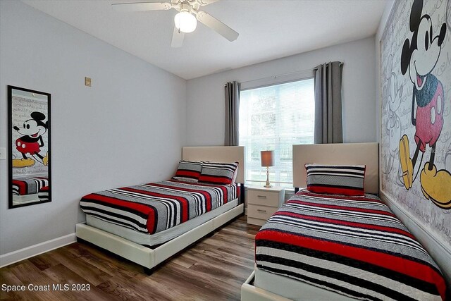 bedroom with dark wood-type flooring and ceiling fan