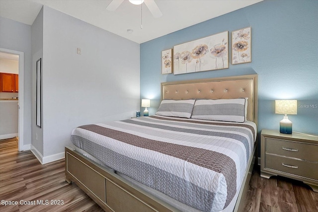 bedroom featuring ensuite bath, dark hardwood / wood-style flooring, and ceiling fan