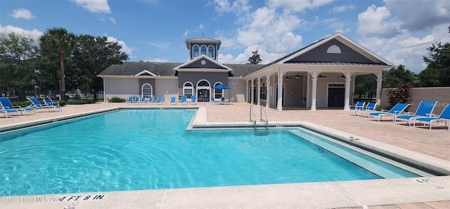 view of swimming pool with a patio area