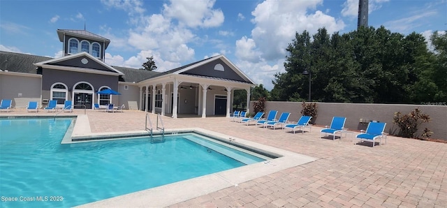 view of swimming pool featuring a patio